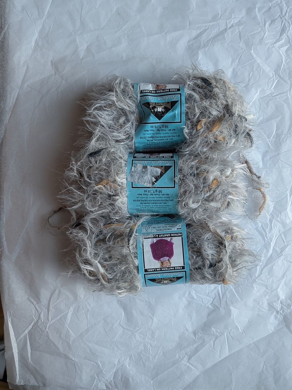 3 skeins of  Fashion Seven yarn in the color 'grey'